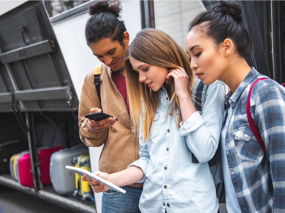 BreakShuttle passengers checking phone