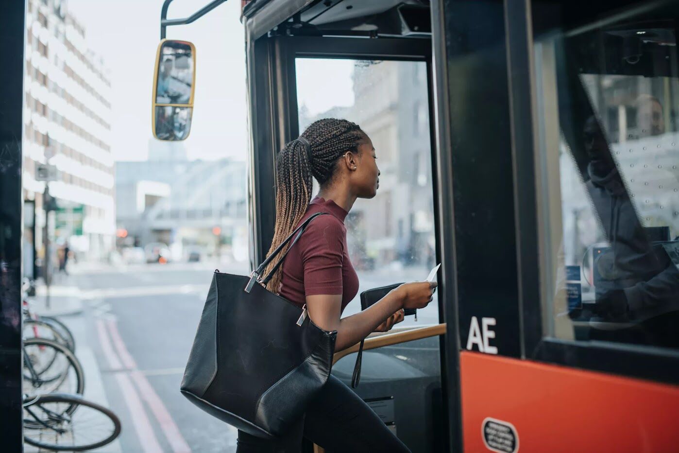 Young girl entering a bus