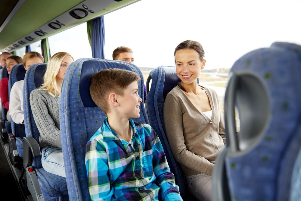 Happy family on a bus